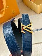 Blue embossed leather belt with gold-toned LV buckle on strap