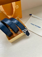 Blue embossed leather belt with silver-toned LV buckle and wide strap