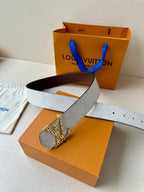 Louis Vuitton belt on box: light gray textured strap with dark brown underside