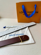 Louis Vuitton belt on dust bag: light gray strap with dark brown buckle and gold clasp