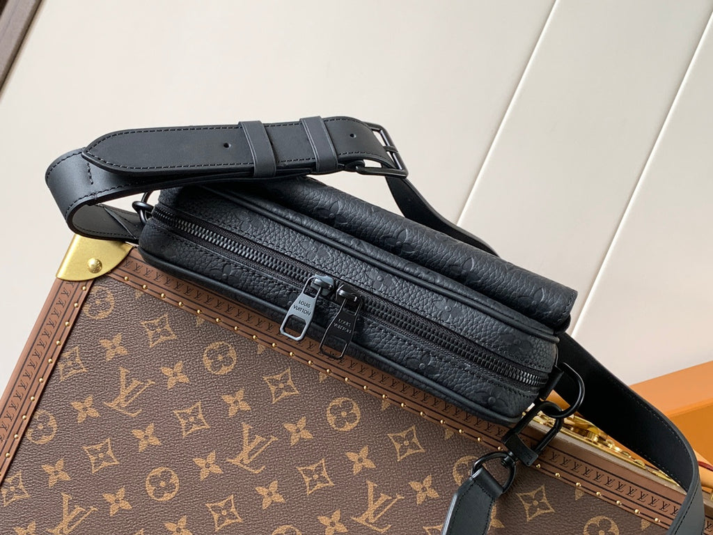 Dark monogram leather crossbody bag with double zipper and adjustable strap