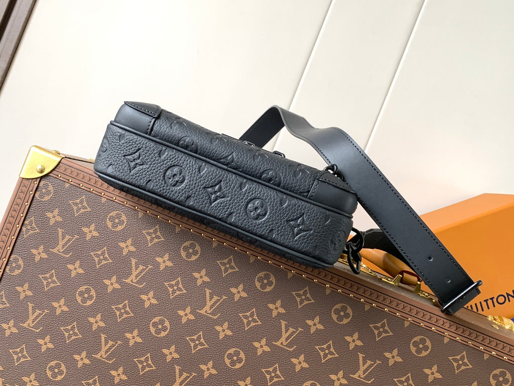 Navy monogram leather crossbody bag with long strap and zippered front pocket