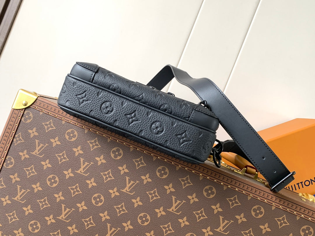 Navy monogram leather crossbody bag with long strap and zippered front pocket