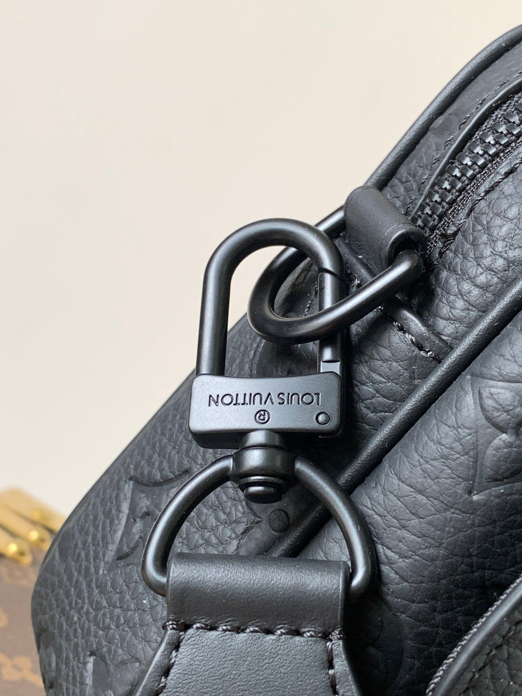 Leather crossbody bag with ring hardware and stamped logo plate
