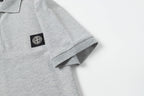 Light gray polo sleeve cuff with small logo patch