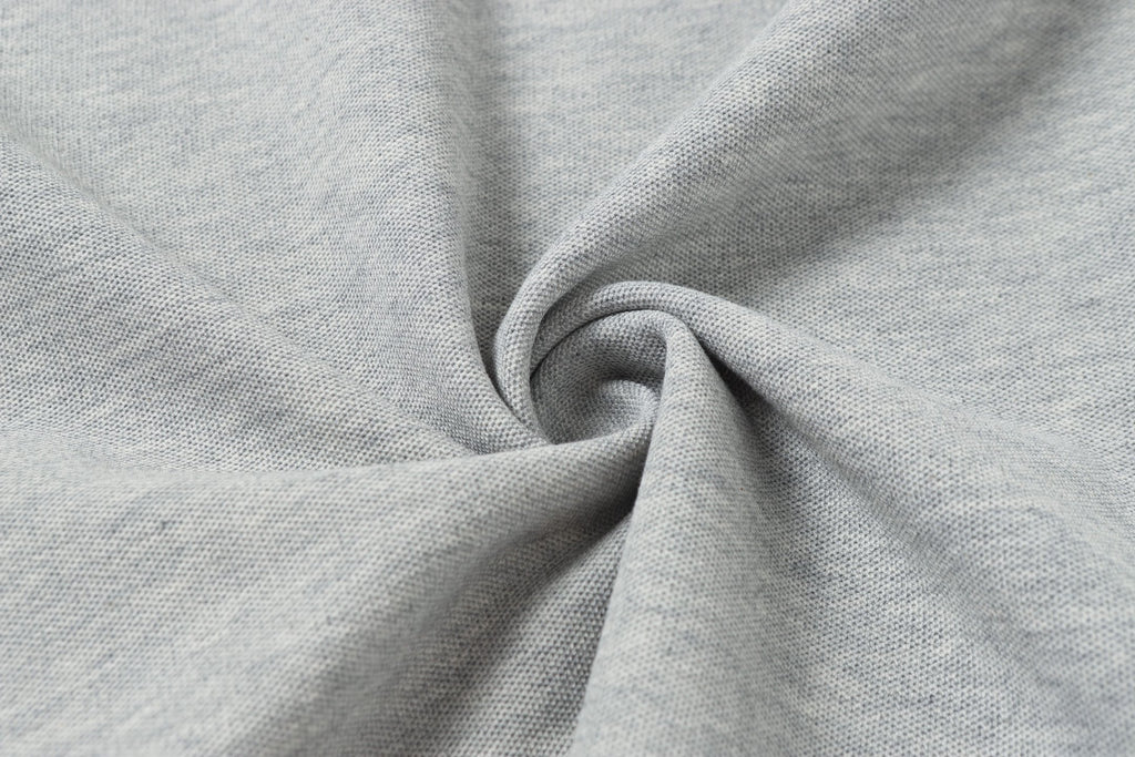 Light gray polo fabric close-up showing knit texture
