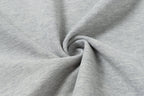 Light gray polo fabric close-up showing knit texture