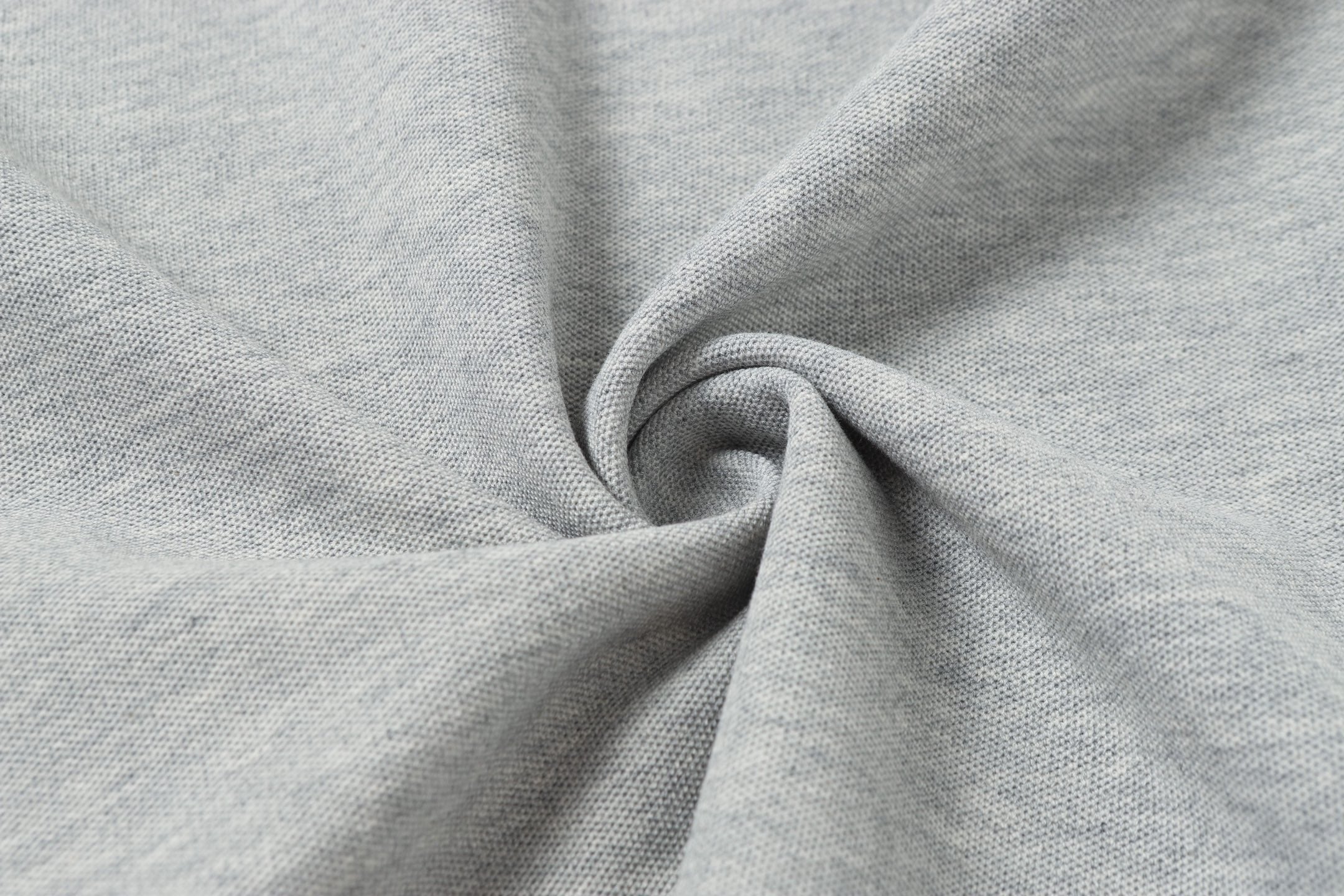 Light gray polo fabric close-up showing knit texture
