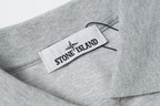 Light gray polo collar with woven logo label