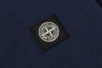 Navy woven logo patch with Stone Island text on polo fabric