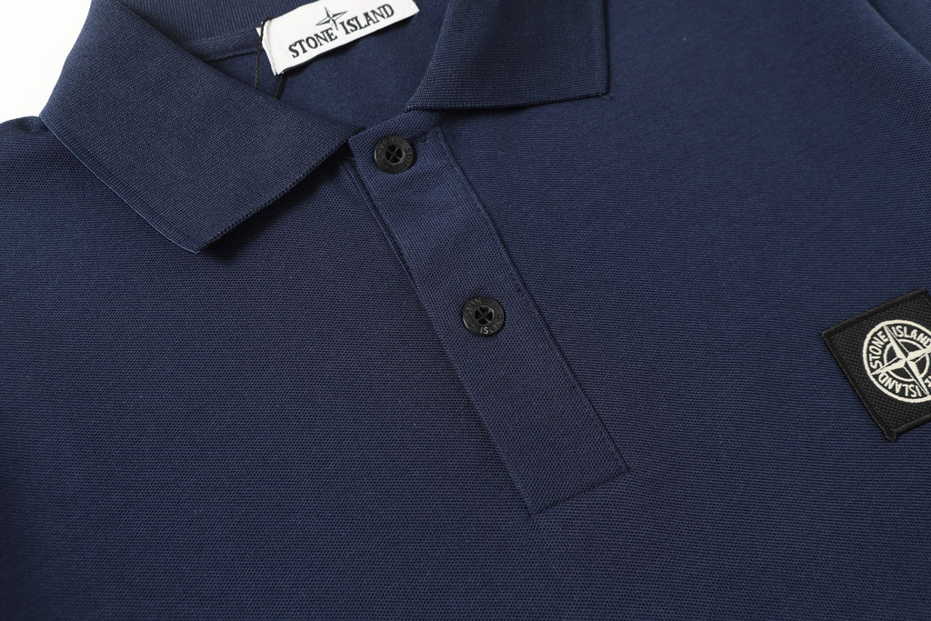 Navy polo shirt with chest logo patch and short sleeves