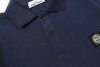 Navy polo shirt with chest logo patch and short sleeves