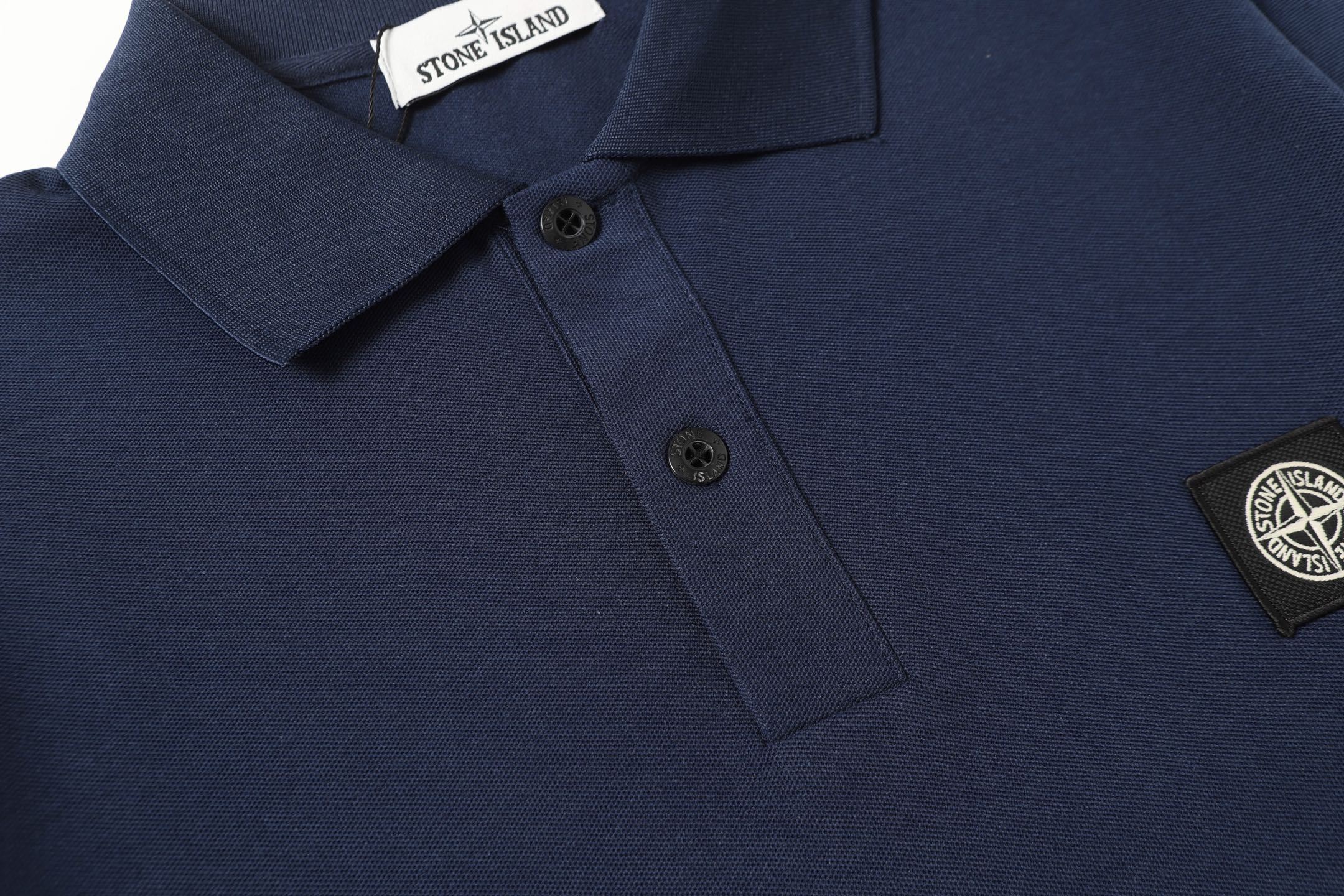 Navy polo shirt with chest logo patch and short sleeves