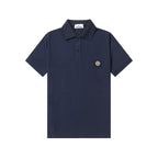 Navy polo shirt with short sleeves, button placket, and chest logo patch