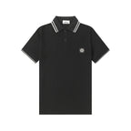 Black Stone Island polo shirt with striped collar and chest badge