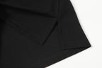 Black polo shirt side seam with stitched hem