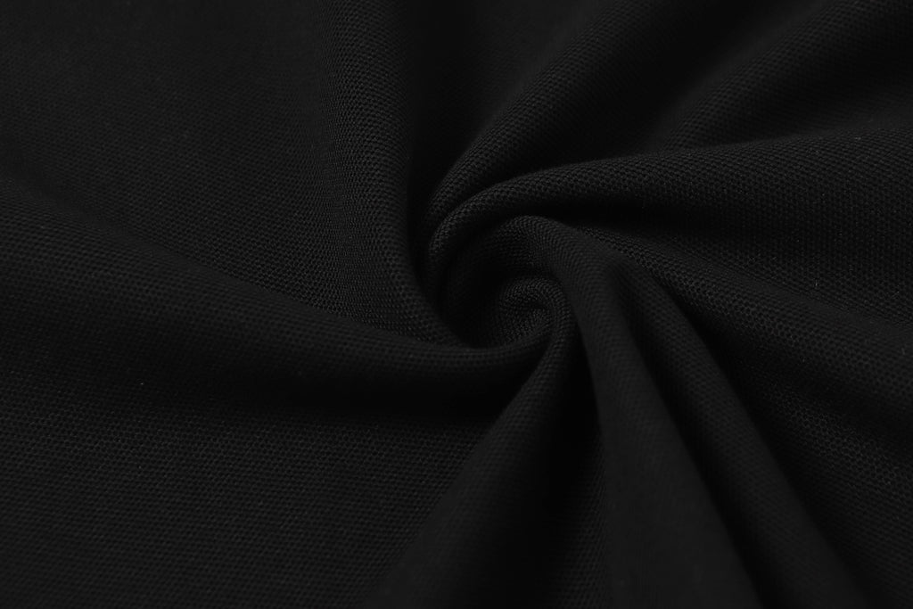 Black textured polo fabric close-up