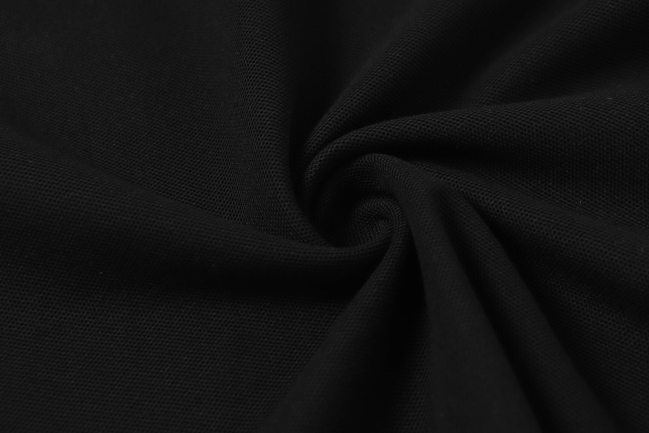 Black textured polo fabric close-up