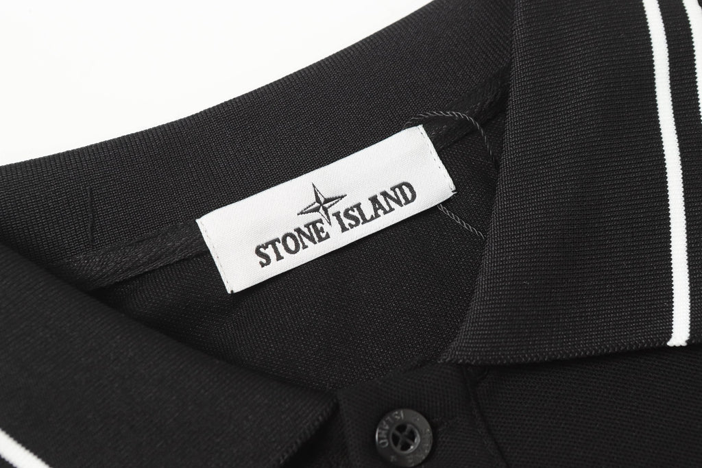 Black polo shirt with Stone Island neck label and striped shoulder trim