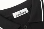 Black polo shirt with Stone Island neck label and striped shoulder trim