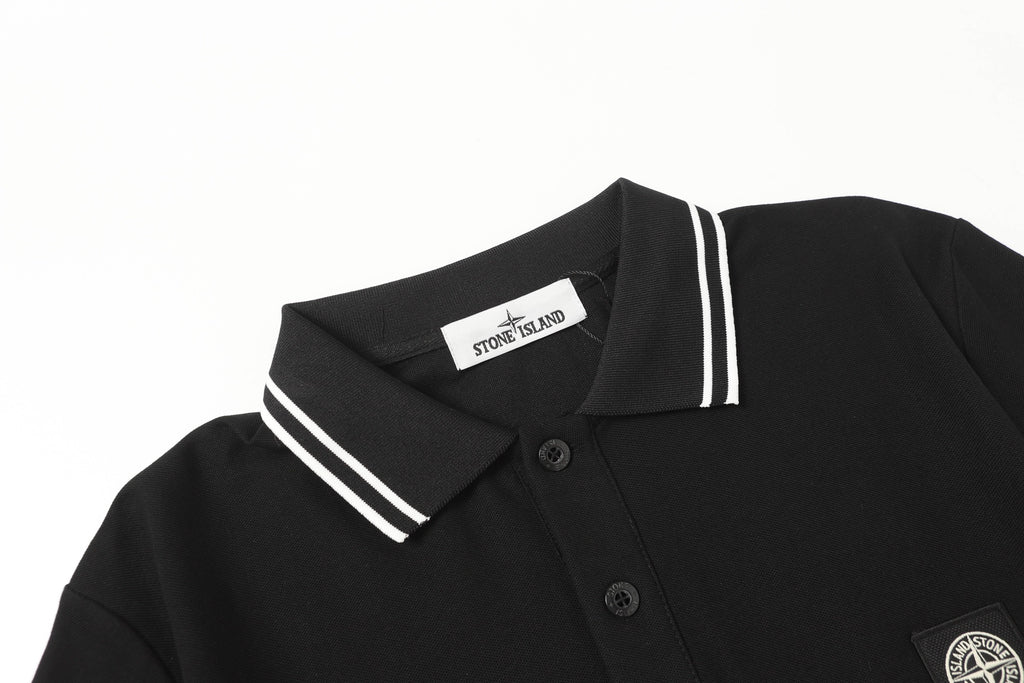 Black polo shirt with striped collar, button placket, and chest patch