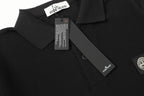 Black polo shirt collar with neck label and button placket