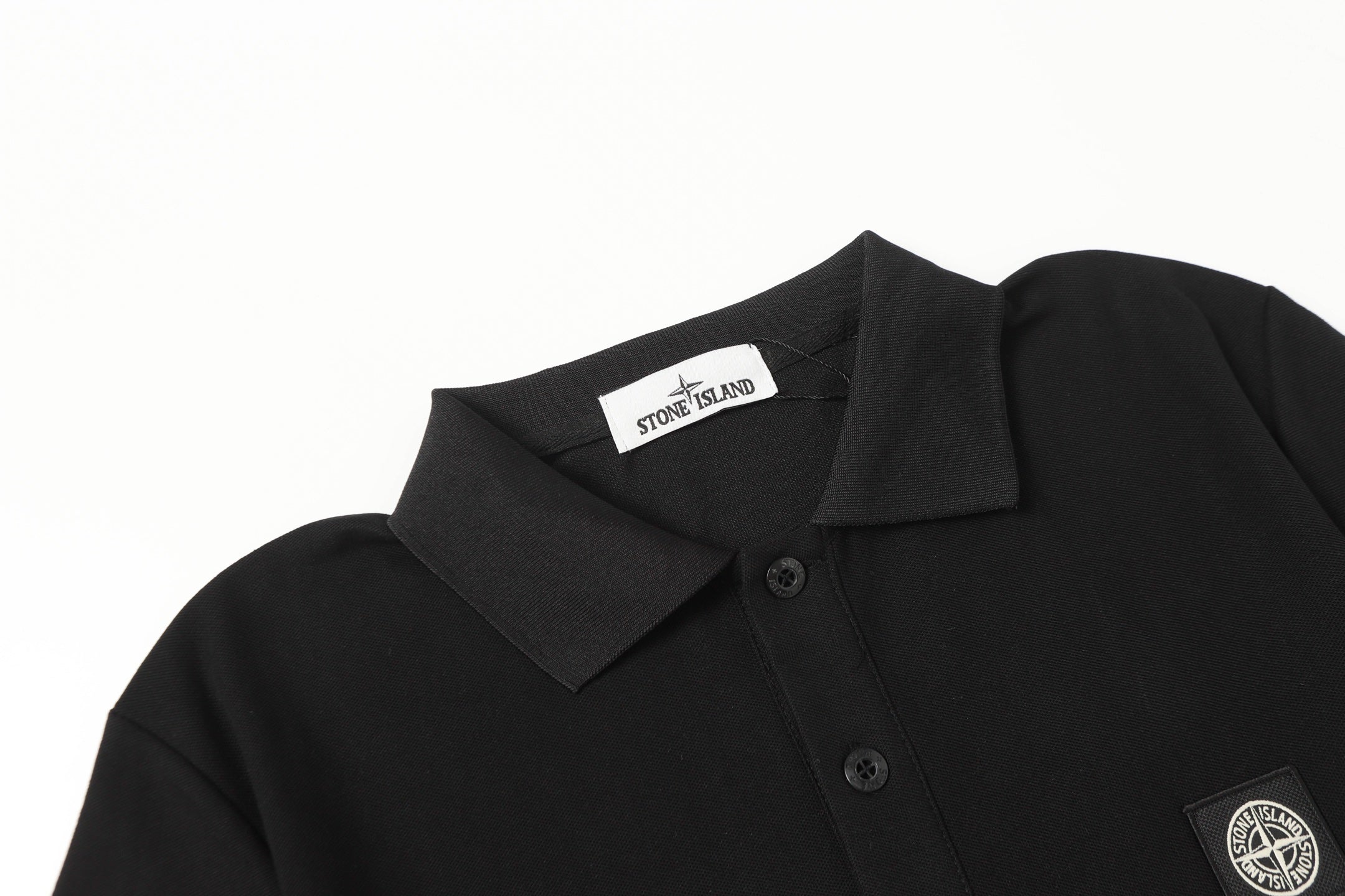 Black polo shirt shoulder and collar with neck label