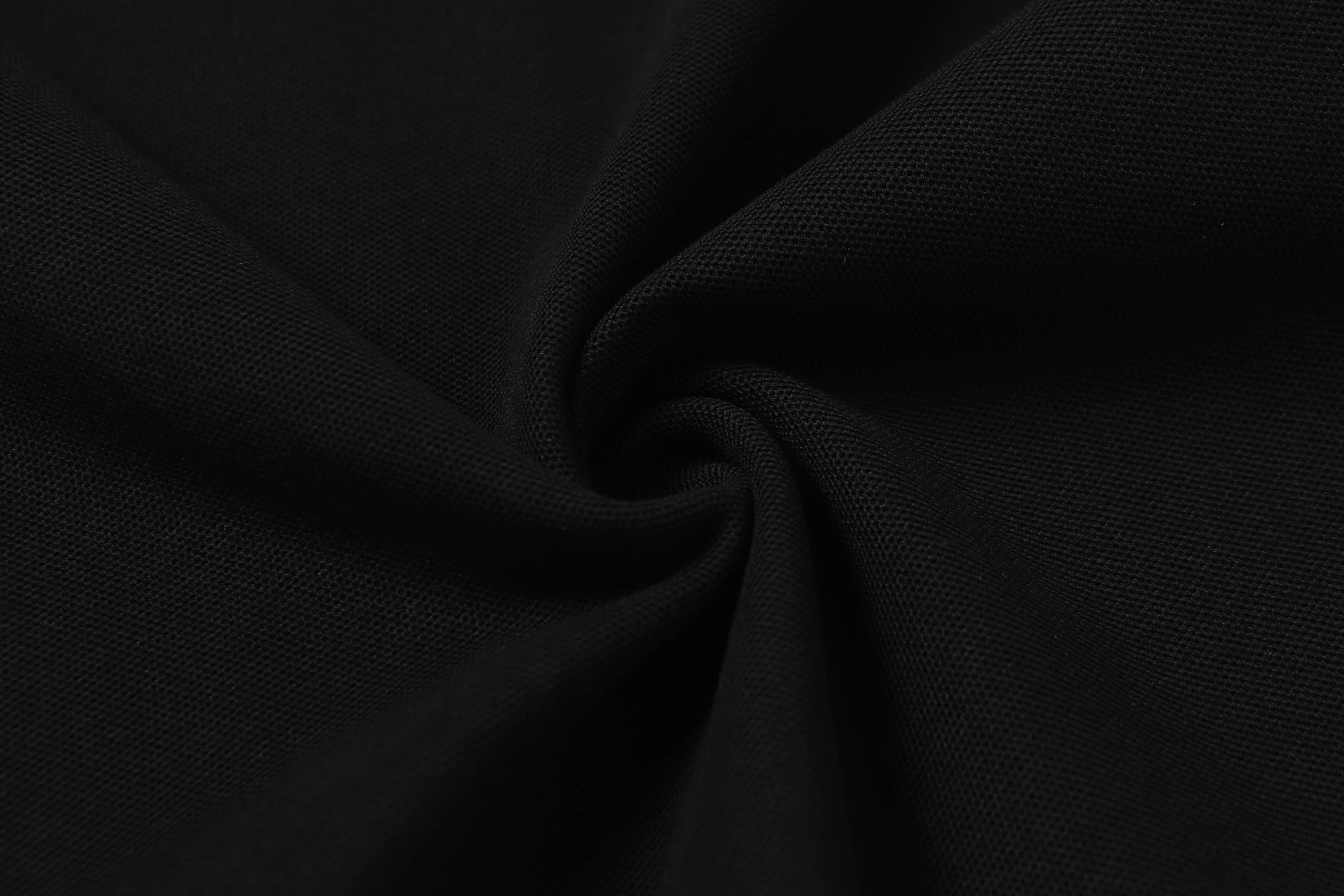 Black polo shirt knit fabric close-up