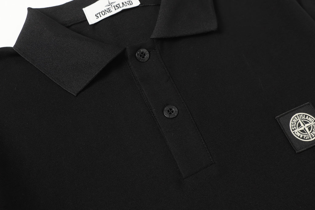 Black polo shirt with short button placket and chest logo patch