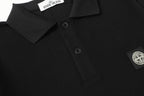 Black polo shirt with short button placket and chest logo patch