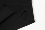 Black polo shirt hem and sleeve seam details