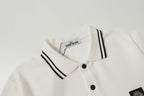 White polo shirt neckline with black striped collar and two-button placket