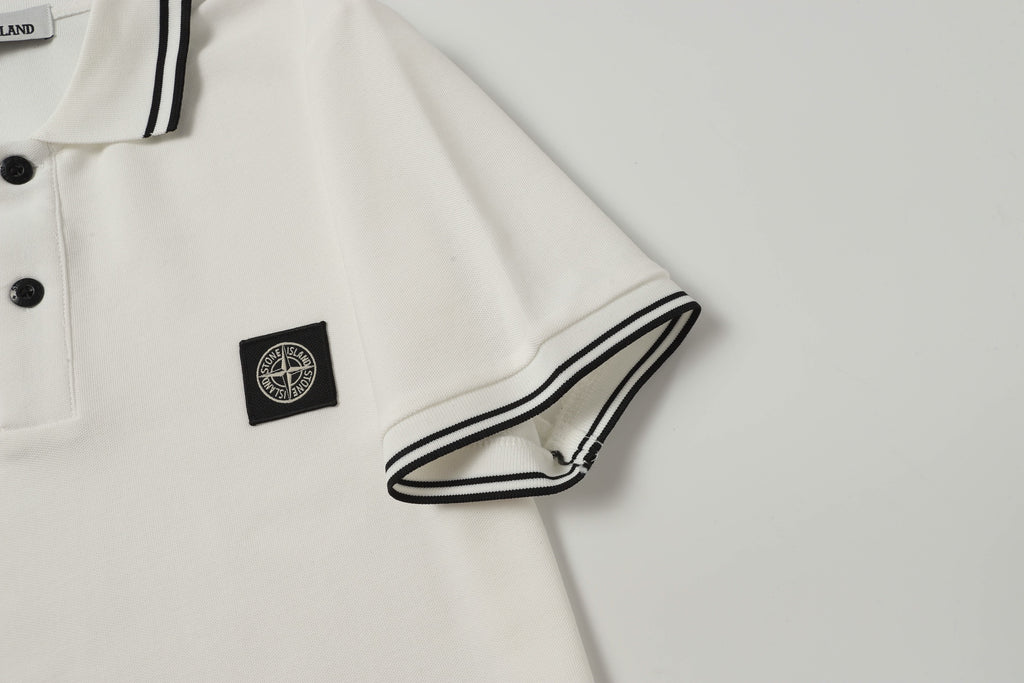 White polo shirt sleeve cuff with black striped trim