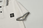 White polo shirt sleeve cuff with black striped trim