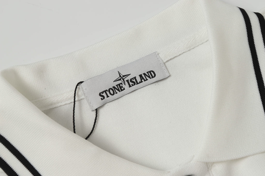 White polo shirt inner label with black Star Stone Island logo