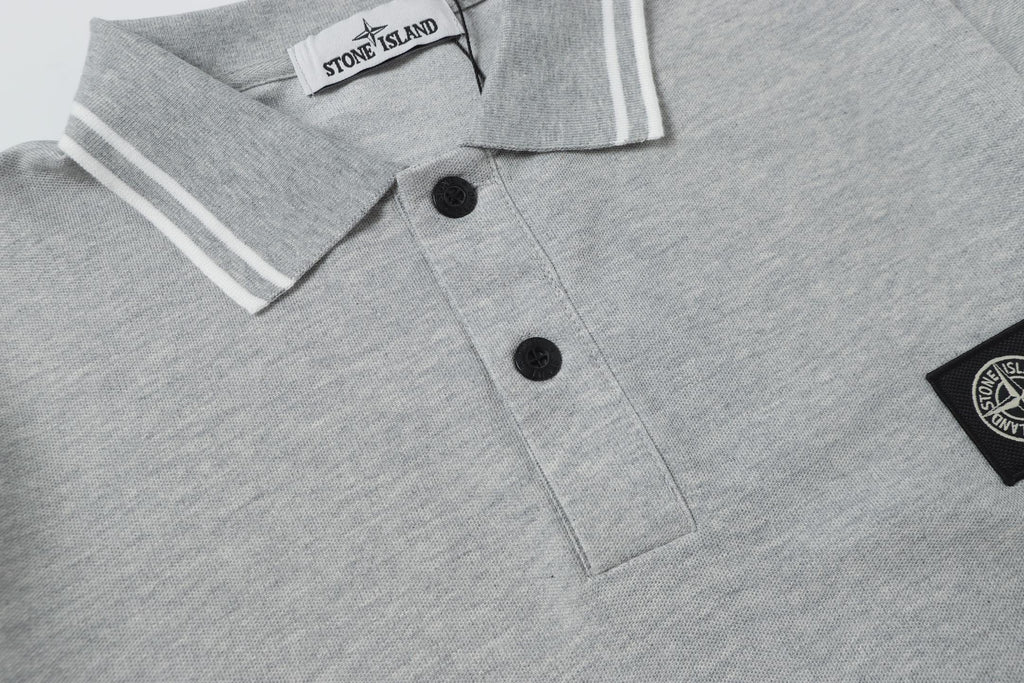 Light gray polo shirt button placket close-up