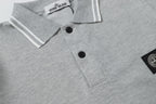Light gray polo shirt button placket close-up