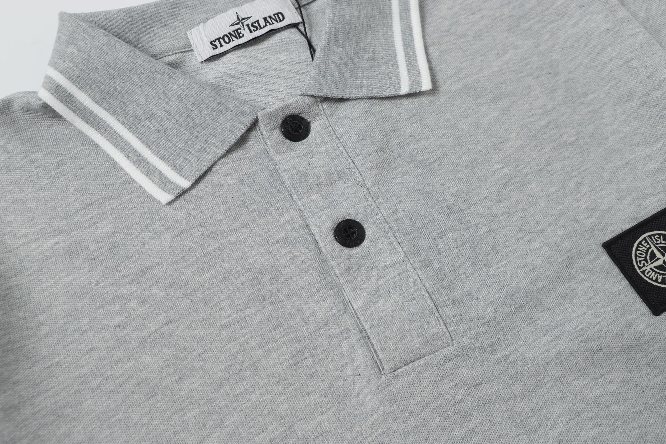Light gray polo shirt button placket close-up