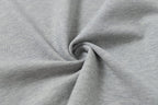 Light gray polo fabric close-up showing knit texture and drape