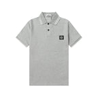 Light gray Stone Island polo shirt with striped collar and chest badge