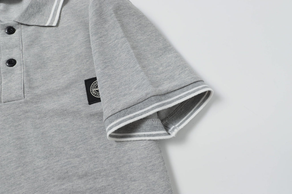 Light gray polo shirt sleeve cuff with striped ribbed trim