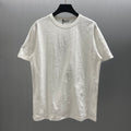 White Dior short-sleeve T-shirt with subtle embossed pattern and crew neckline