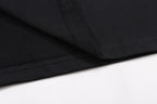 Black T-shirt close-up of side seam and hem stitching