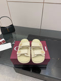 Gucci women's cream slide sandals with double buckles and gold-tone logo detailing