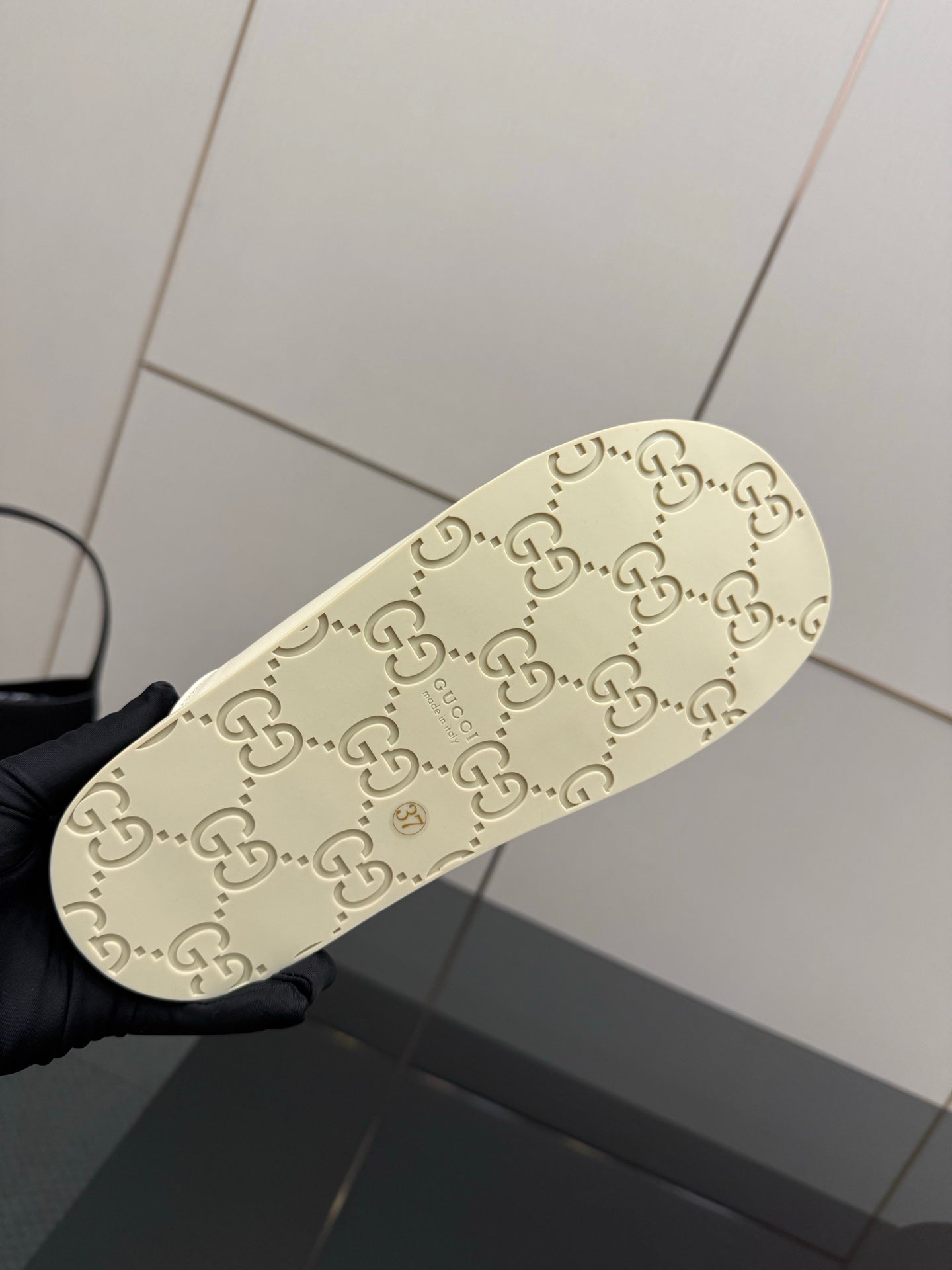 Gucci women's cream sandal outsole with signature GG logo pattern
