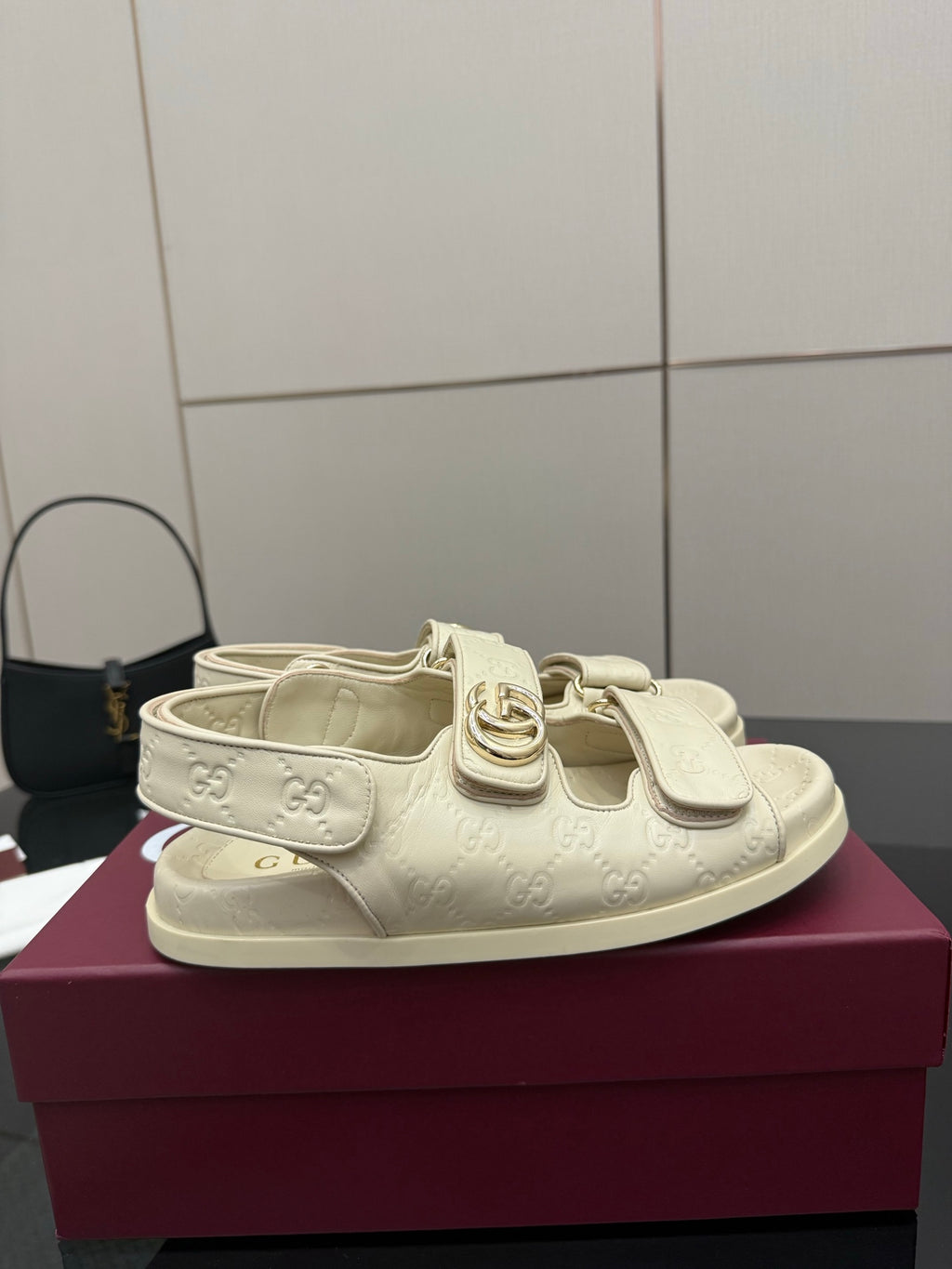 Cream platform slide sandals with double straps and metal buckle