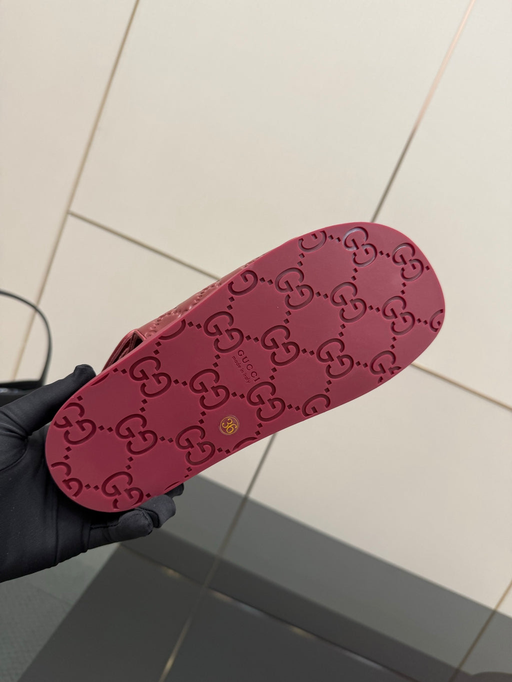 Red Gucci logo-pattern rubber outsole for slide sandal, bottom view