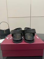Gucci women's black sandals with double-G buckle, back view on the footbed