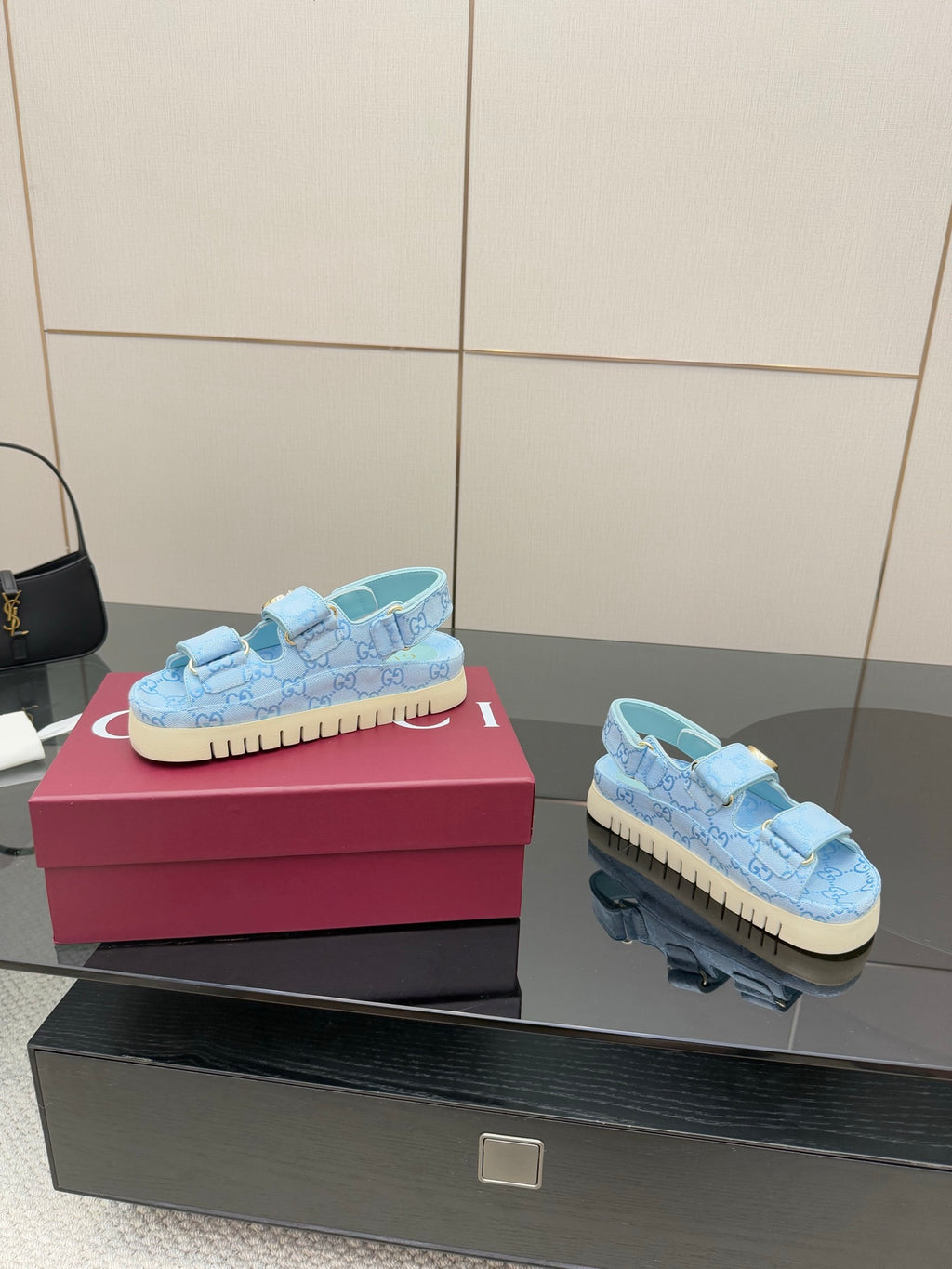 Gucci ladies light blue GG-pattern sneakers, side view with gold buckle and textured sole