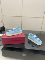 Gucci ladies light blue GG-pattern sneakers, side view with gold buckle and textured sole